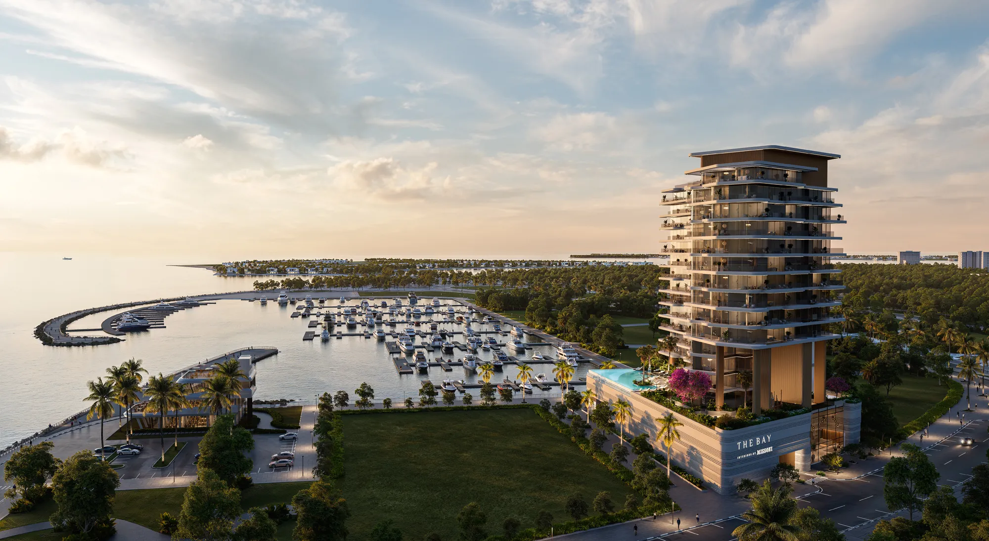 Daytime view of The Bay Interiors by Missoni tower beside the Island A yacht marina on Dubai Islands, with a pool on the podium